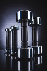 close-up view of shiny dumbbells, sport and healthy lifestyle concept