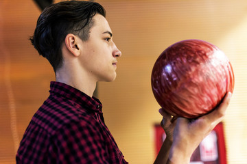 Boy carrying the bowling ball