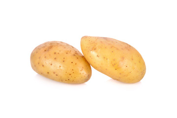 whole unpeeled fresh potatoes on white background