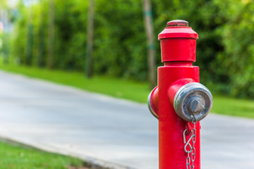 Red fire hydrant along the road close up