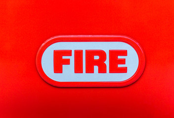 word fire on a red background close-up