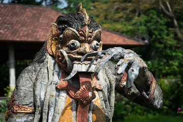 Frightening hindu wooden statue found at the tirta gangga water palace in Karangasem, Bali, Indonesia (17.05.2018)