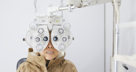 Asian Old woman checking on eye