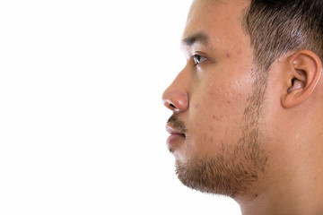 Fototapeta premium Close up profile view of young Asian man 