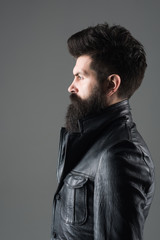 Profile portrait of bearded man. Barber Shop concept. Fashion. Trendy clothes. Bearded man in black jacket. Biker. Leather jacket