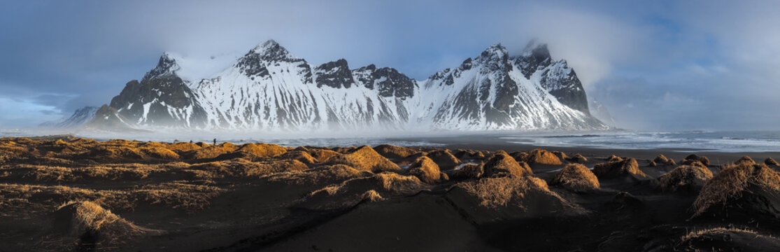 Black sand dunes on the Stokksnes headland on southeastern Icelandic coast with Vestrahorn (Batman Mountain). Colorful summer morning Iceland, Europe.