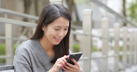 Fototapeta premium Young woman use of mobile phone