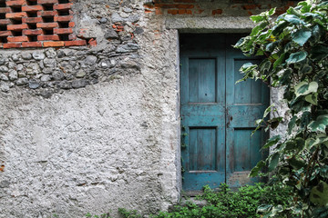 Fototapeta na wymiar Blue door in old village