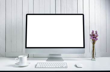 workplace background with Blank white screen modern desktop computer. White wooden vintage blackground