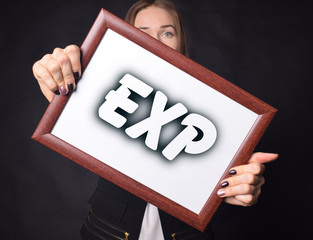 In the hands of a businessman a frame with the inscription:EXP
