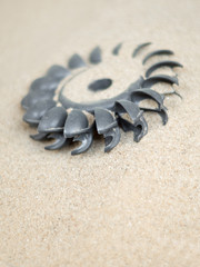 Fototapeta na wymiar Plastic Pelton water turbine on sand with out water