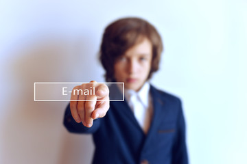 Button e-mail with a hand. A young man presses the e-mail button. Electronic Technology
