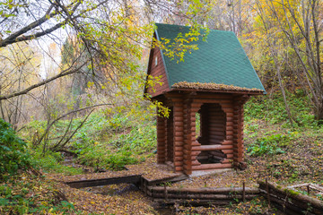 Wooden chapel near the Holy spring in the forest