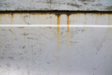 rusty stains on painted white metal parts