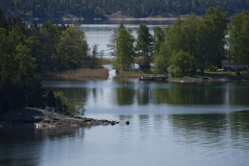 Fototapeta na wymiar Stockholm archipelago an early summer morning day with a tranquil sea and blue sky