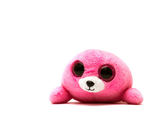 Plush purple colored seal with big eyes - toy for babies isolated on white background