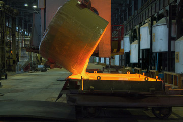 Molten glass being poured into a mold