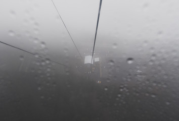 A gondola cuts its way through the mist and fog