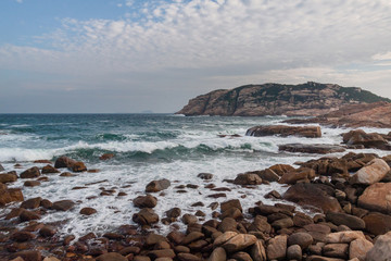 Fototapeta na wymiar Cliff at Shek O, the ocean with the Rocks in Hong Kong
