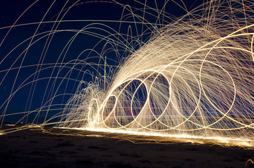 The art of the spinning steel wool making beauty in the night sky. 