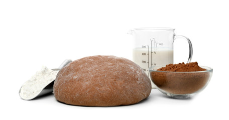 Composition with rye dough and products on white background