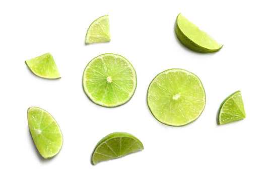 Fresh ripe limes on white background, top view
