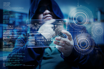 Hacker using clear tablet with HUD panel and code graph bar data analytsis element for cyber technology concept, dark and grain process, shallow depth of field select focus on hands