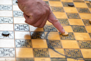 Chessboard with game of checkers