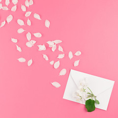 Flat lay of white letter mock up with petals