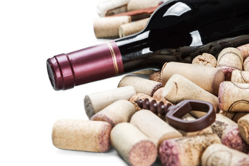  bottle with red wine and wine stoppers isolated on white background