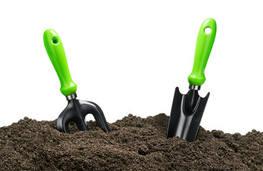 garden tools in soil isolated on white background