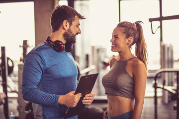 Couple talking at gym.