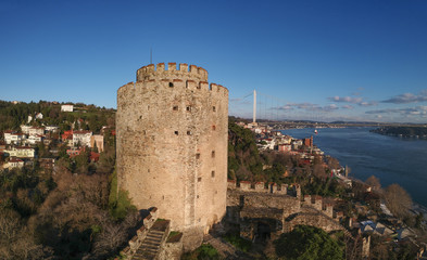 Naklejka premium Aerial view of Rumeli Castle and Fatih Sultan Mehmet Bridge in Istanbul Turkey