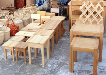Wooden homemade chairs and tables are sold on the street during the traditional spring fair