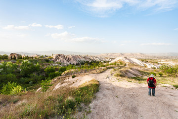 tourist near little orchard in Uchisar village