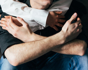 Holding hands. Lovers couple holding hands in a room. Hand in hand. hug