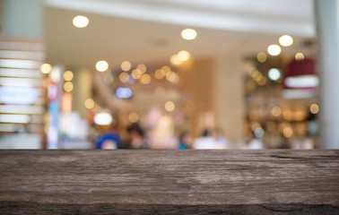 Empty wood table top and blur of night market background/selective focus .For montage product display.