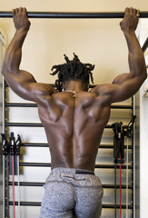 Bodybuilder Doing Pull-ups in the Gym