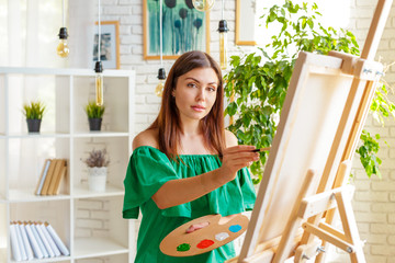 Creative woman working in art studio