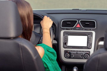 Young woman driving a car in the city.