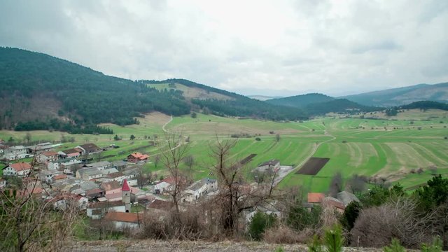 A huge plain and a village. It's a foggy autumn day. On this plane there used to be an intermittent lake.