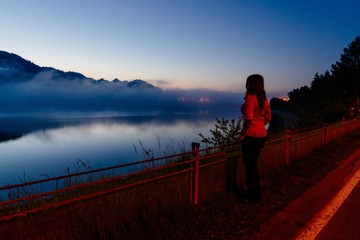 Fototapeta na wymiar Woman at Czorsztyn Lake at dawn.