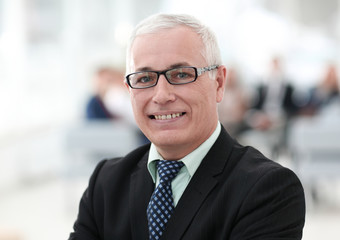 Fototapeta premium close up portrait of senior businessman in office