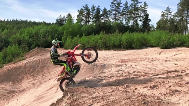 slow motion enduro mx in sand jump