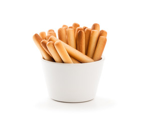 Salted  bread sticks in white bowl isolated