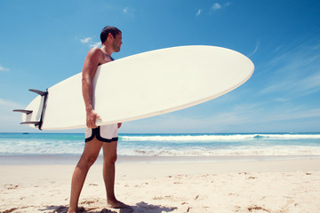 Naklejka na ściany i meble surfer at beach