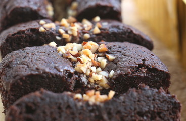 Chocolate cake with almond topping close up shot.