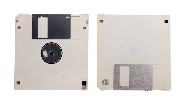 Obsolete technology - two used floppy discs isolated on white