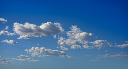 cumulus clouds perfect white in blue sky