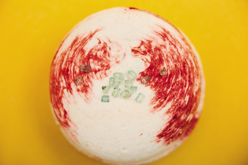 Tasty sweet macaron on yellow background. Close up.
   